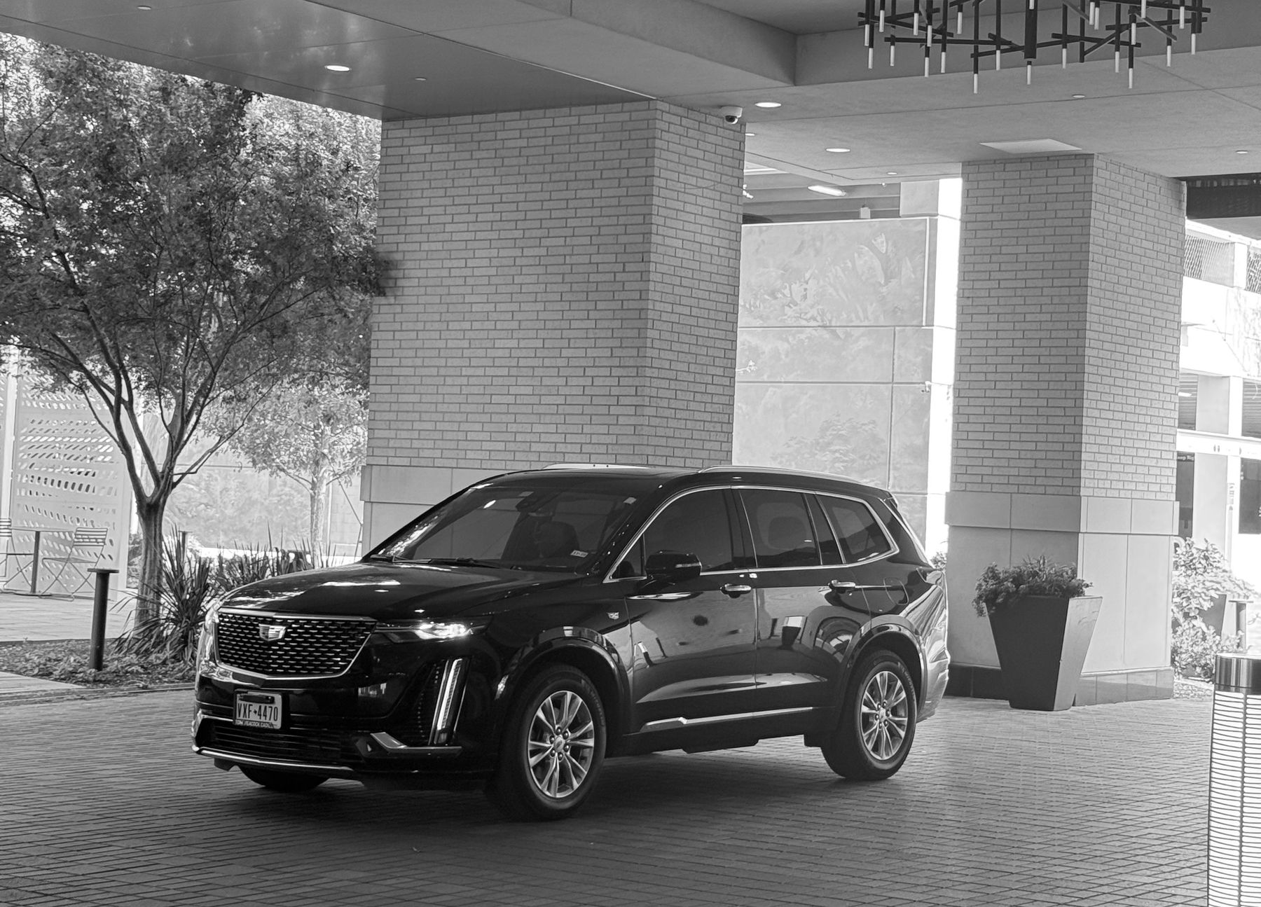 Cadillac XT6 under a hotel canopy